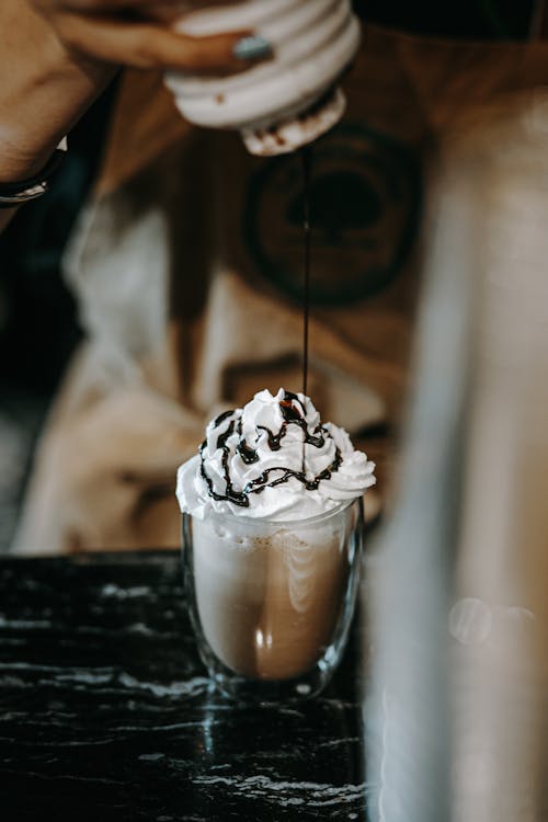Coffee with Whipped Cream and Chocolate Sauce