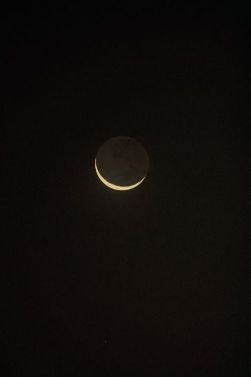 Free A tranquil crescent moon set against a deep black sky, capturing the essence of nighttime space exploration. Stock Photo