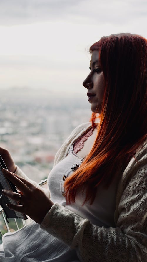 Redhead Woman Reading a Book