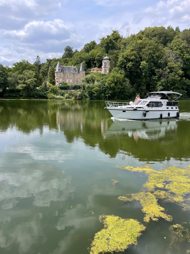 Yacht Sailing By Castle Of Flie In France