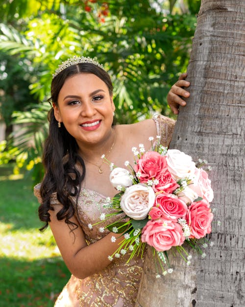 Free Portrait of Brunette Woman with Flowers Bouquet Stock Photo