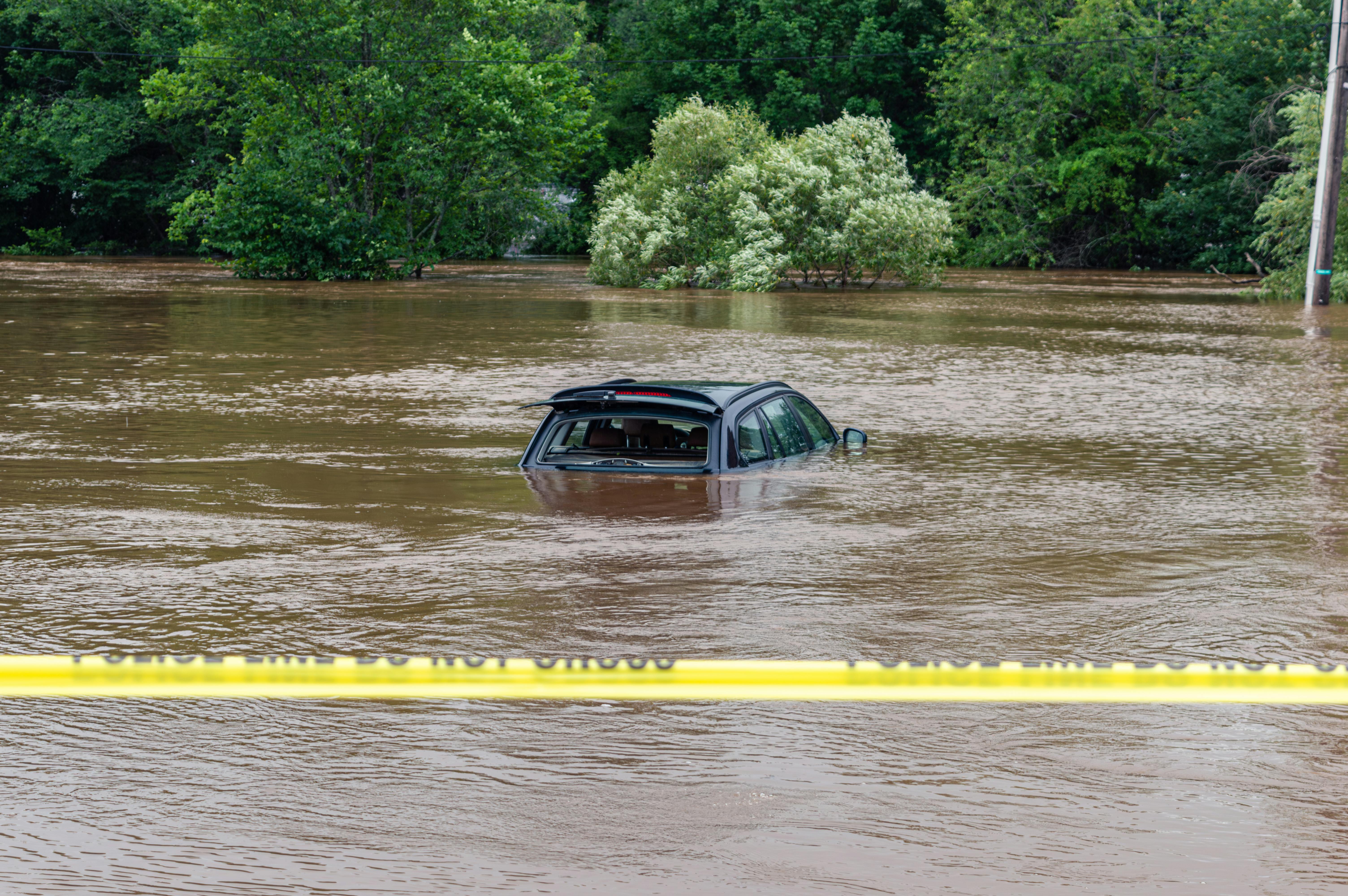 Heavy machinery crushing large pieces of waste concrete into smaller aggregates at a recycling plant