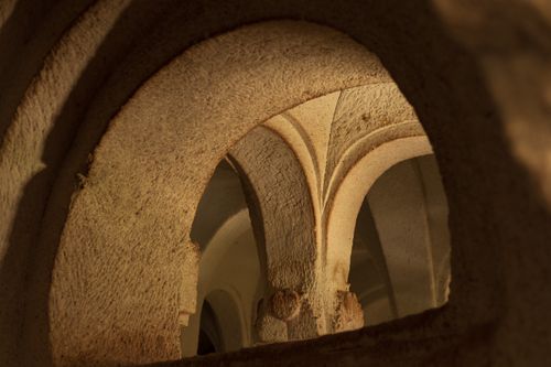 Free Close-up view of historical stone archways with intricate designs in warm light. Stock Photo