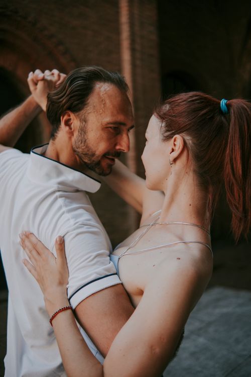 Free Close-up of a couple dancing intimately in an urban setting, showcasing romance. Stock Photo