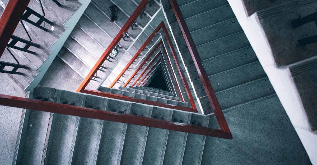 Triangular Staircase with Red Handrail · Free Stock Photo