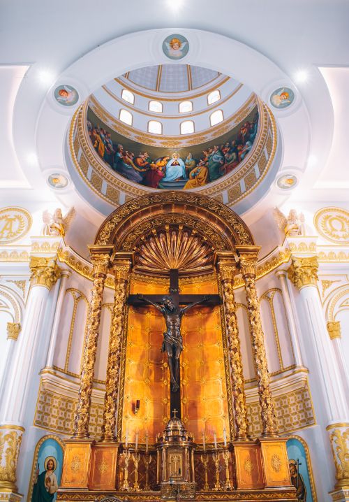 Free Intricate gold altar and ornate ceiling in the sacred Annai Velankanni Shrine, India. Stock Photo