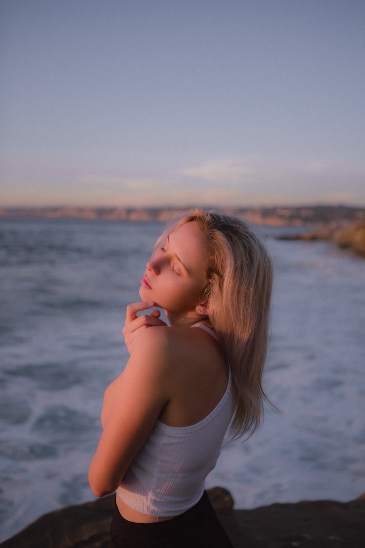 Blonde Relaxing By Sea