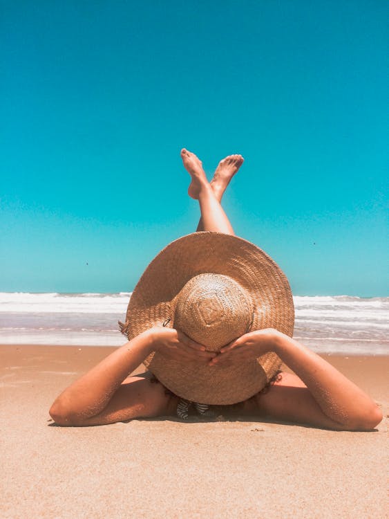 Free Person Laying On Sand  Stock Photo