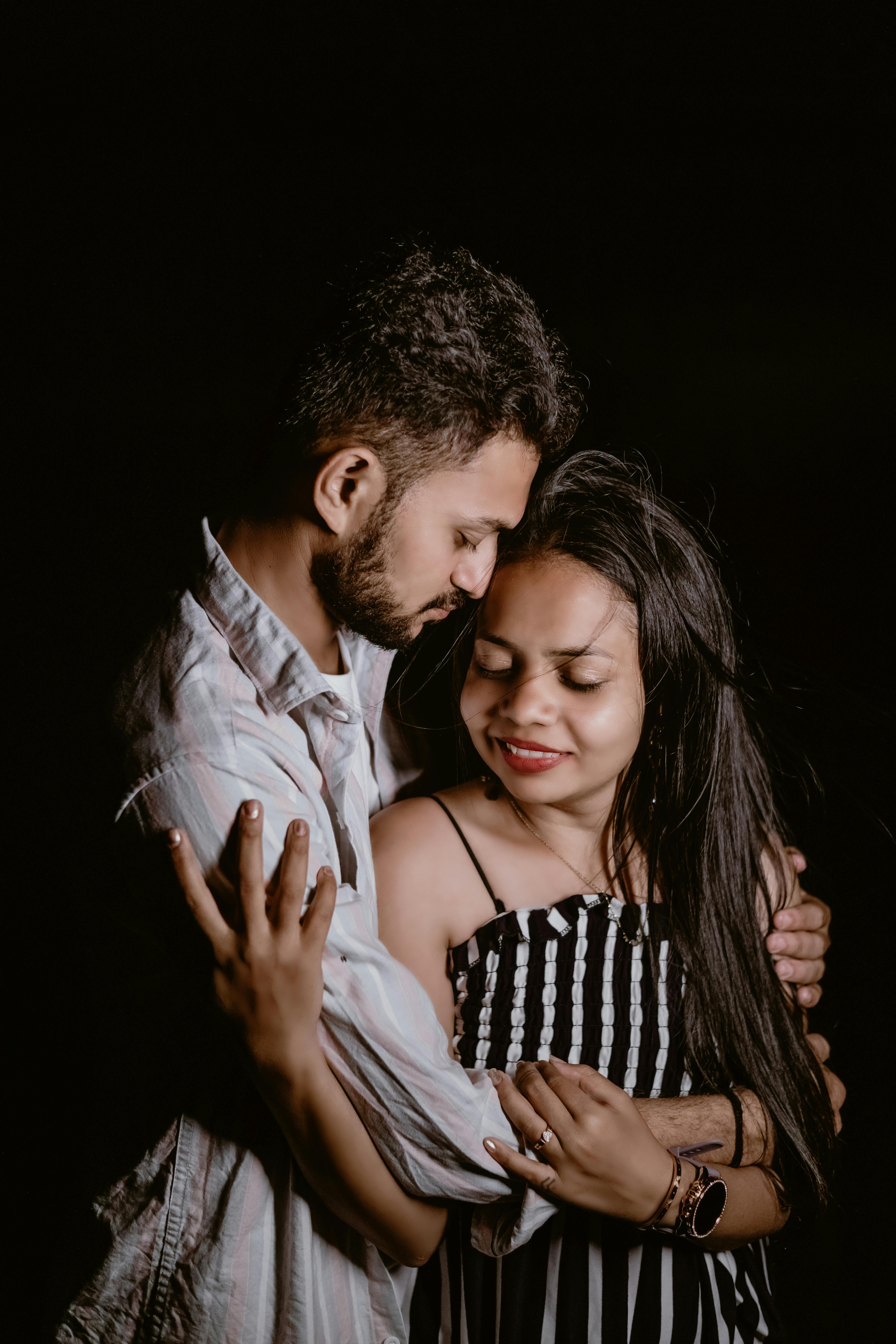Couple Together on Black Background · Free Stock Photo