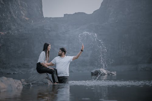 Smiling Woman and Man in Lake