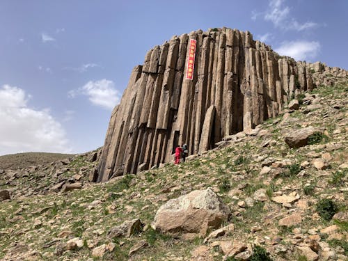Sunlit Rock Formation on Hill