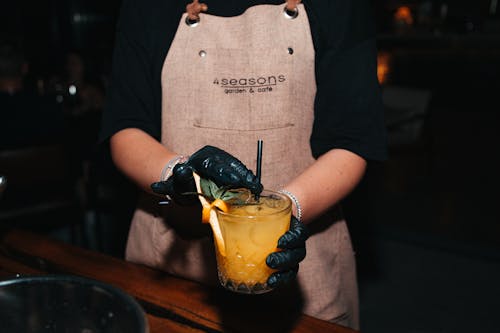 Waiter Hands Holding Fruit Cocktail