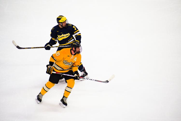 Hockey Players Playing Inside A Rink