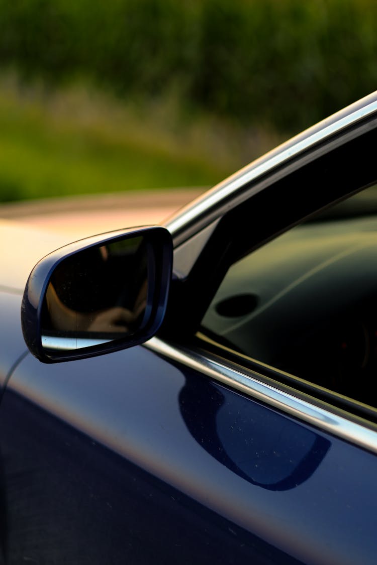 Close Up Of Car Mirror And Window