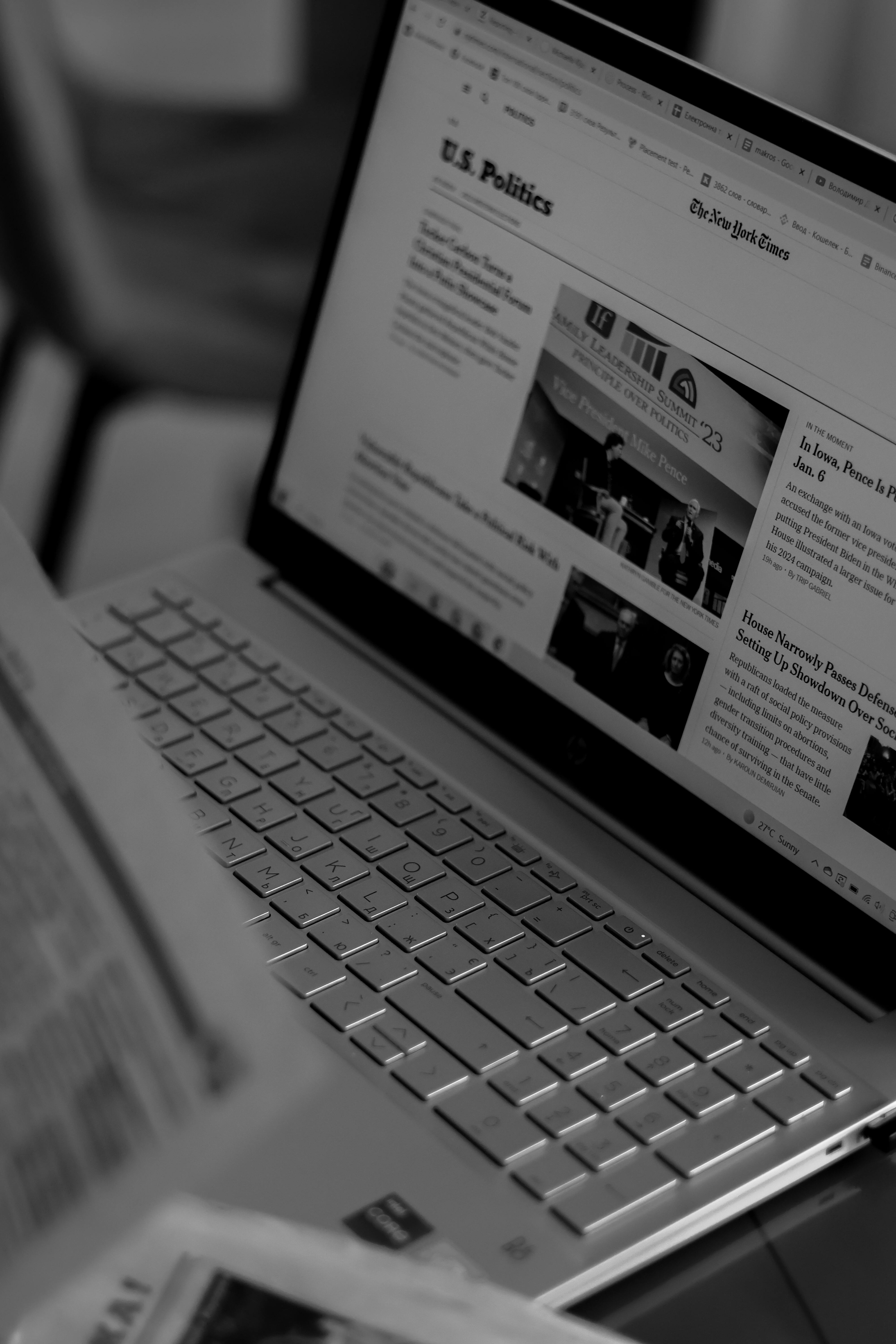 news on laptop screen in black and white