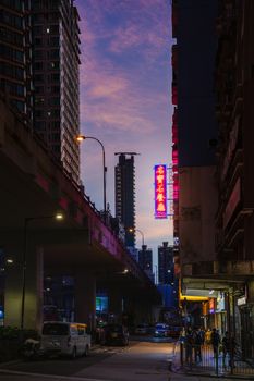 Captivating view of Hong Kong's cityscape under a twilight sky, showcasing urban architecture.