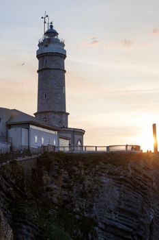The Faro Cabo Mayor lighthouse overlooking the cliff at sunrise, Santander, Spain.
