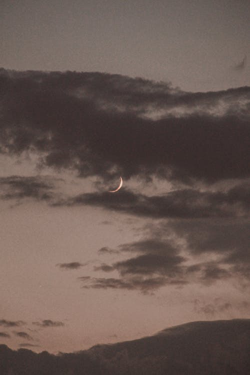 Crescent Moon in the Cloudy Sky