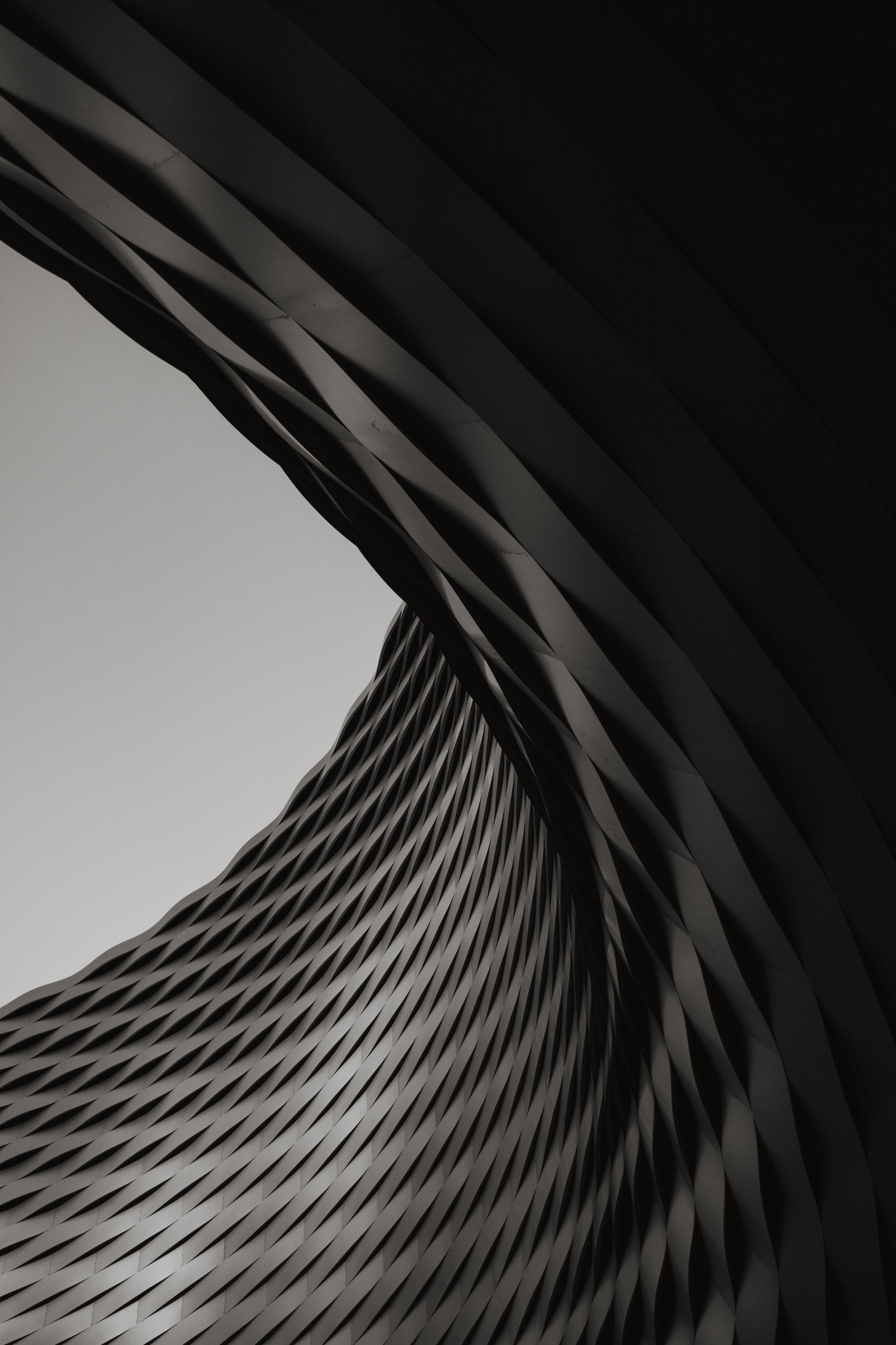 Black and white abstract spiral structure showcasing modern architectural design.