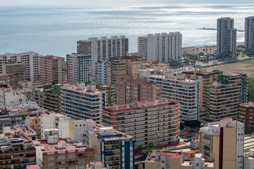 Free Stunning aerial view of Valencia's coastal cityscape with modern architecture and the shimmering sea. Stock Photo