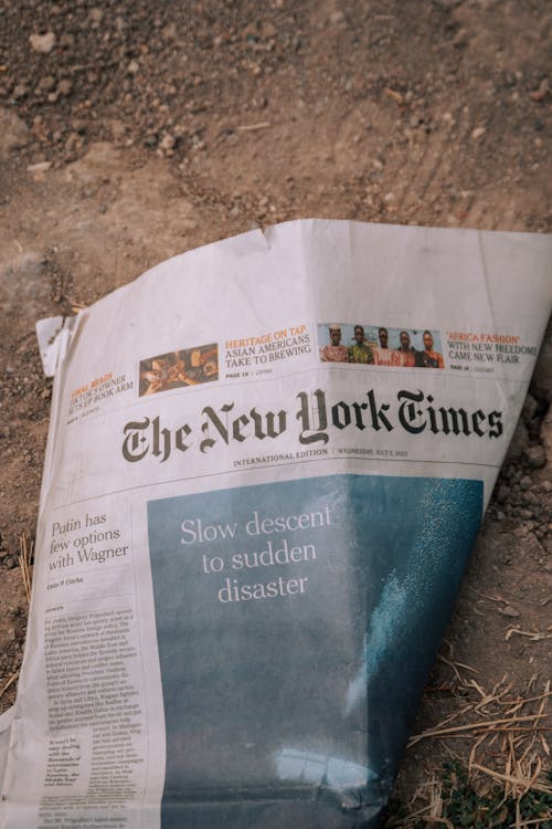 Free New York Times Newspaper Lying on the Ground Stock Photo