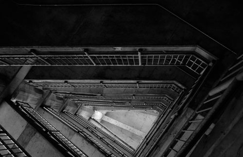 Free A striking overhead view of a geometric staircase in black and white. Stock Photo