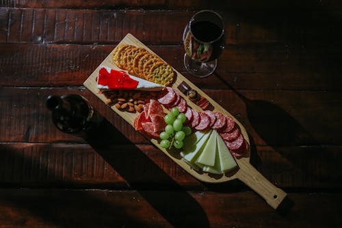 Red Wine and Cutting Board with Snacks 