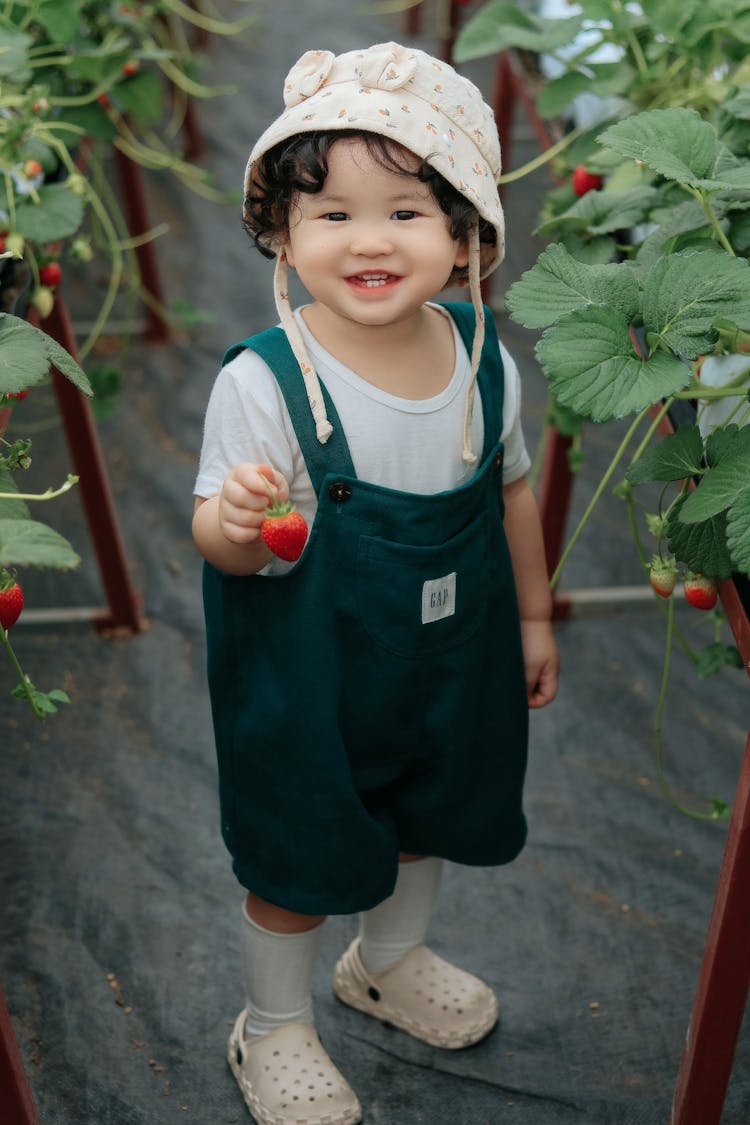 Little Girl In A Green House