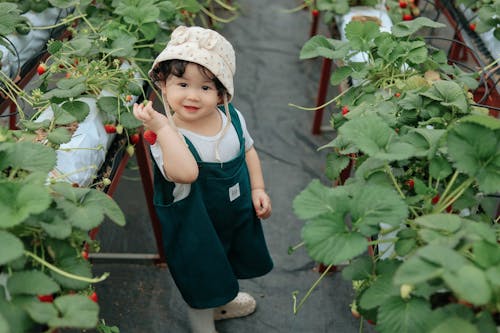 Smiling Girl in Greenhouse