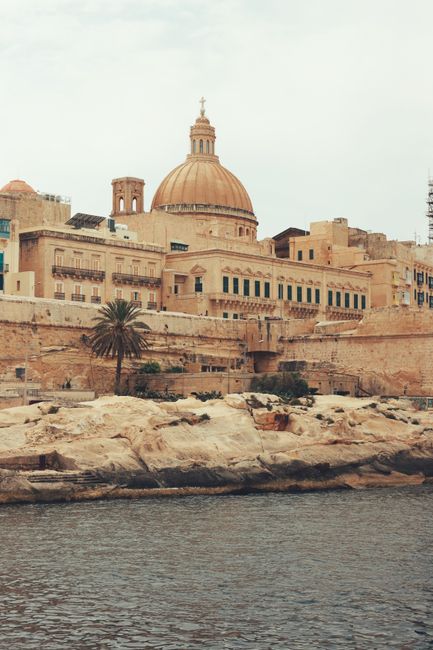 Explore Valletta's iconic dome and neoclassical architecture along Malta's coast.