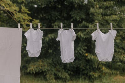 Beautifully crafted eco-friendly Kenyan garments hanging in an open-air market