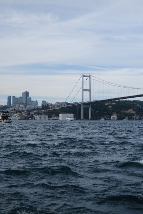 Free Beautiful view of the Bosphorus Bridge in Istanbul with a calm sea and city skyline. Stock Photo