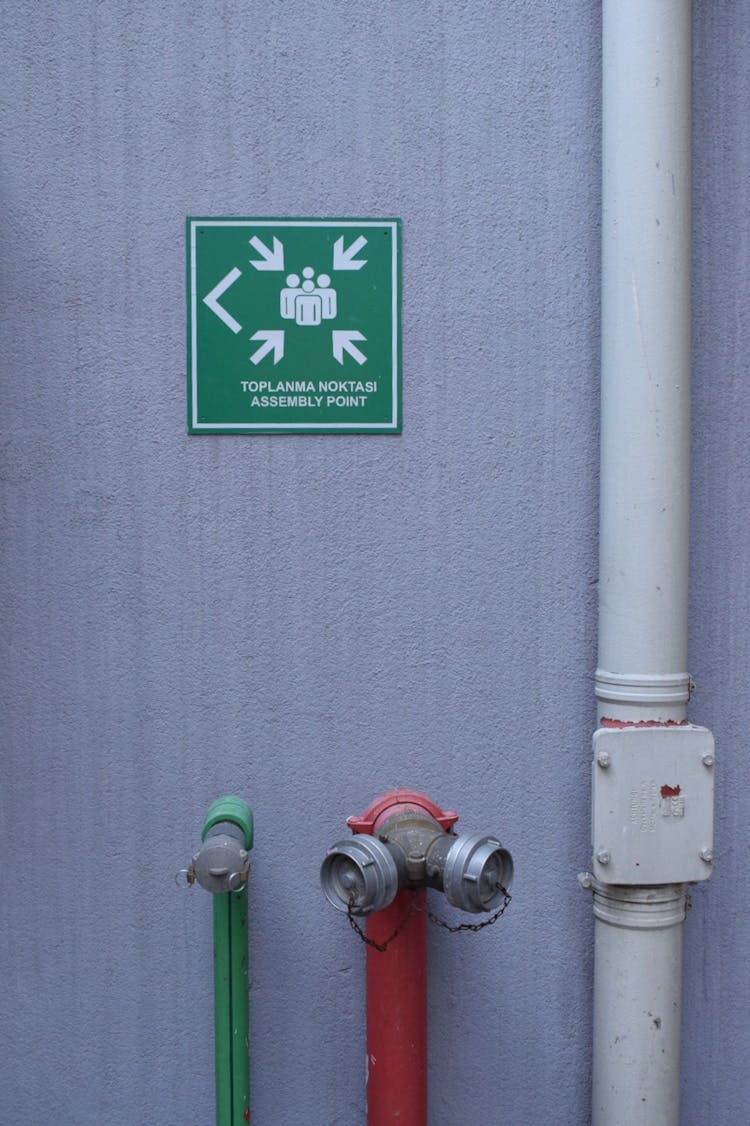 A Fire Hydrant And A Sign