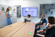 Meeting of Walls Website Employees in the Conference Room