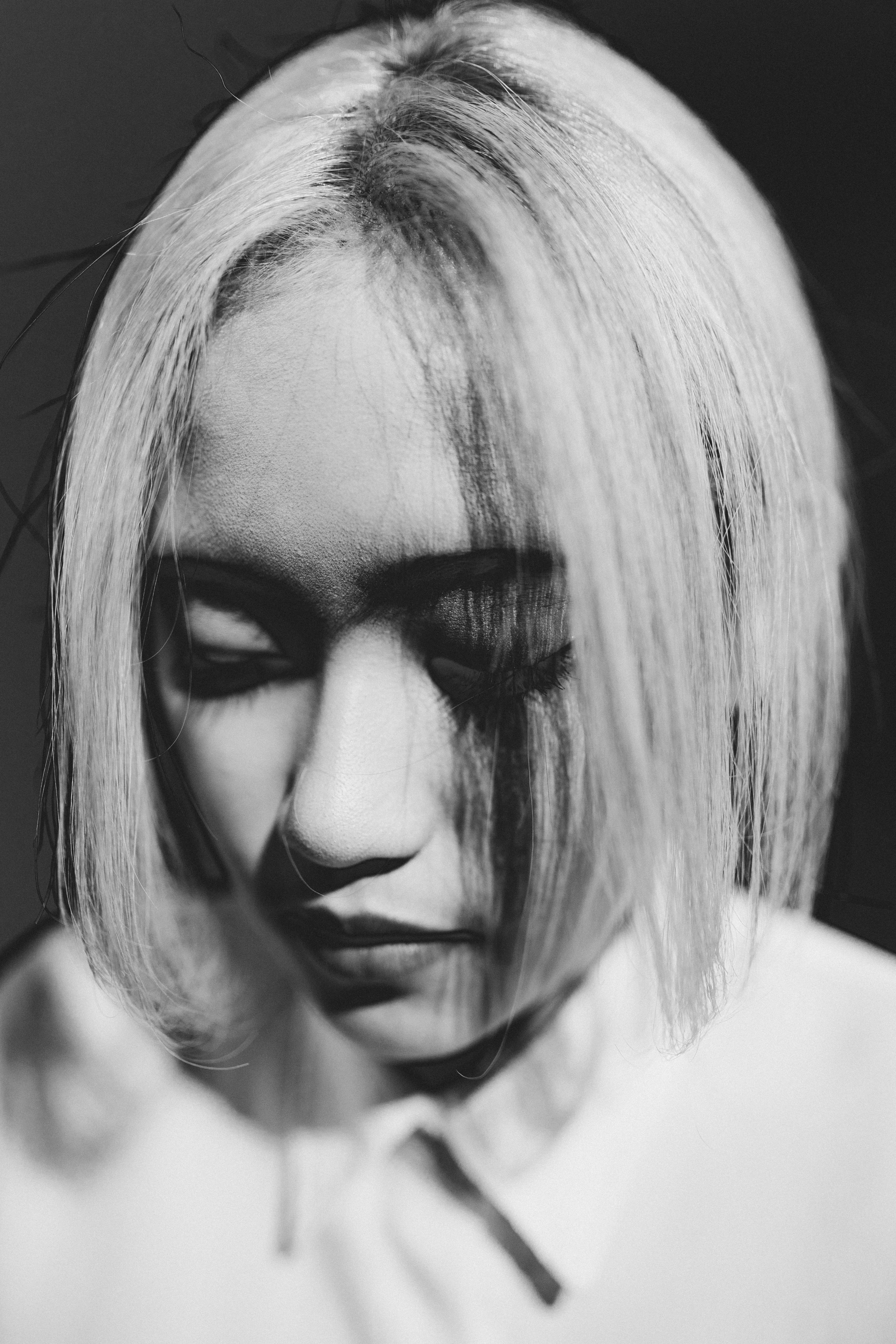 A black and white photo of a woman with short hair · Free Stock Photo