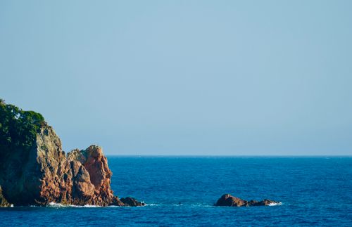 Free Beautiful coastal cliffs in Himarë, Albania overlooking the vast blue sea. Stock Photo