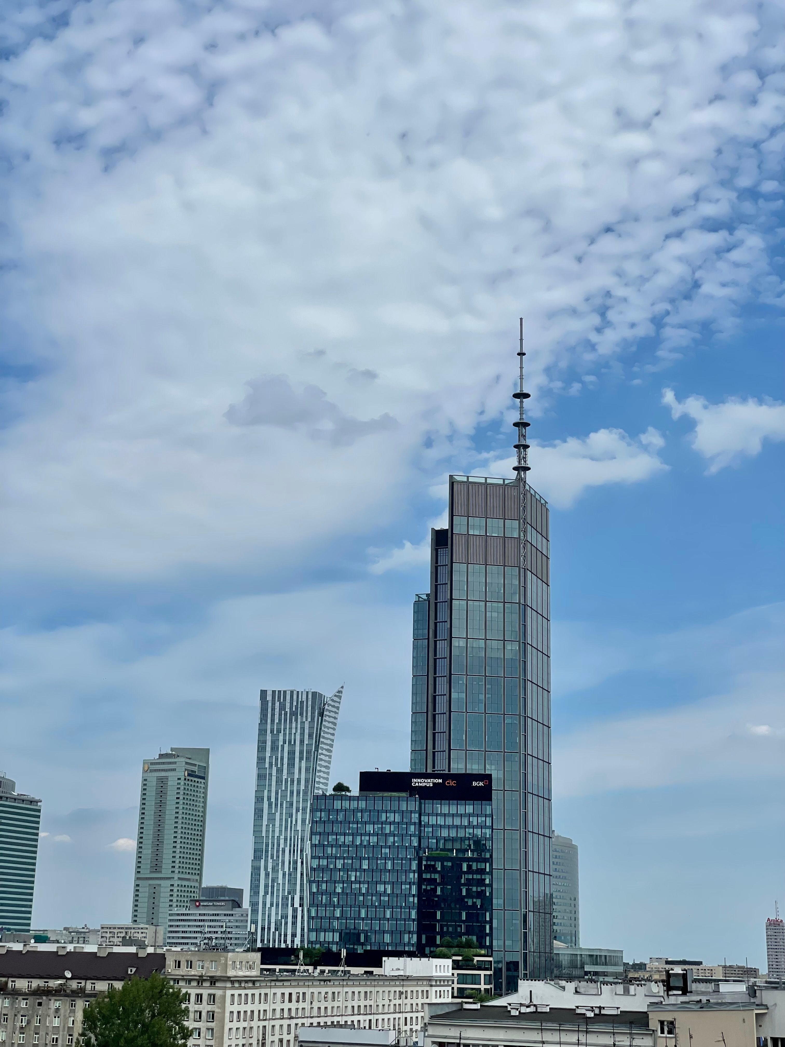 A view of a city with tall buildings and a blue sky · Free Stock Photo