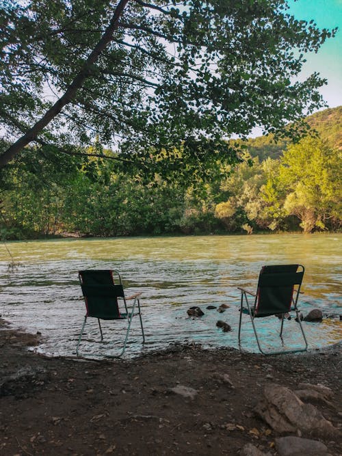 Two Chairs by a River 