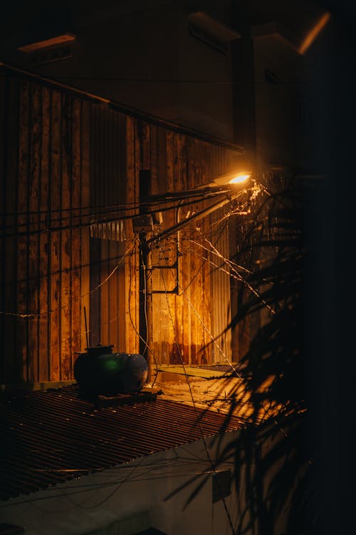 A night scene with a light on a wall