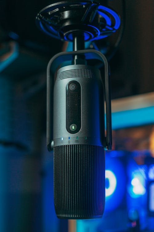 A microphone with a blue light on it