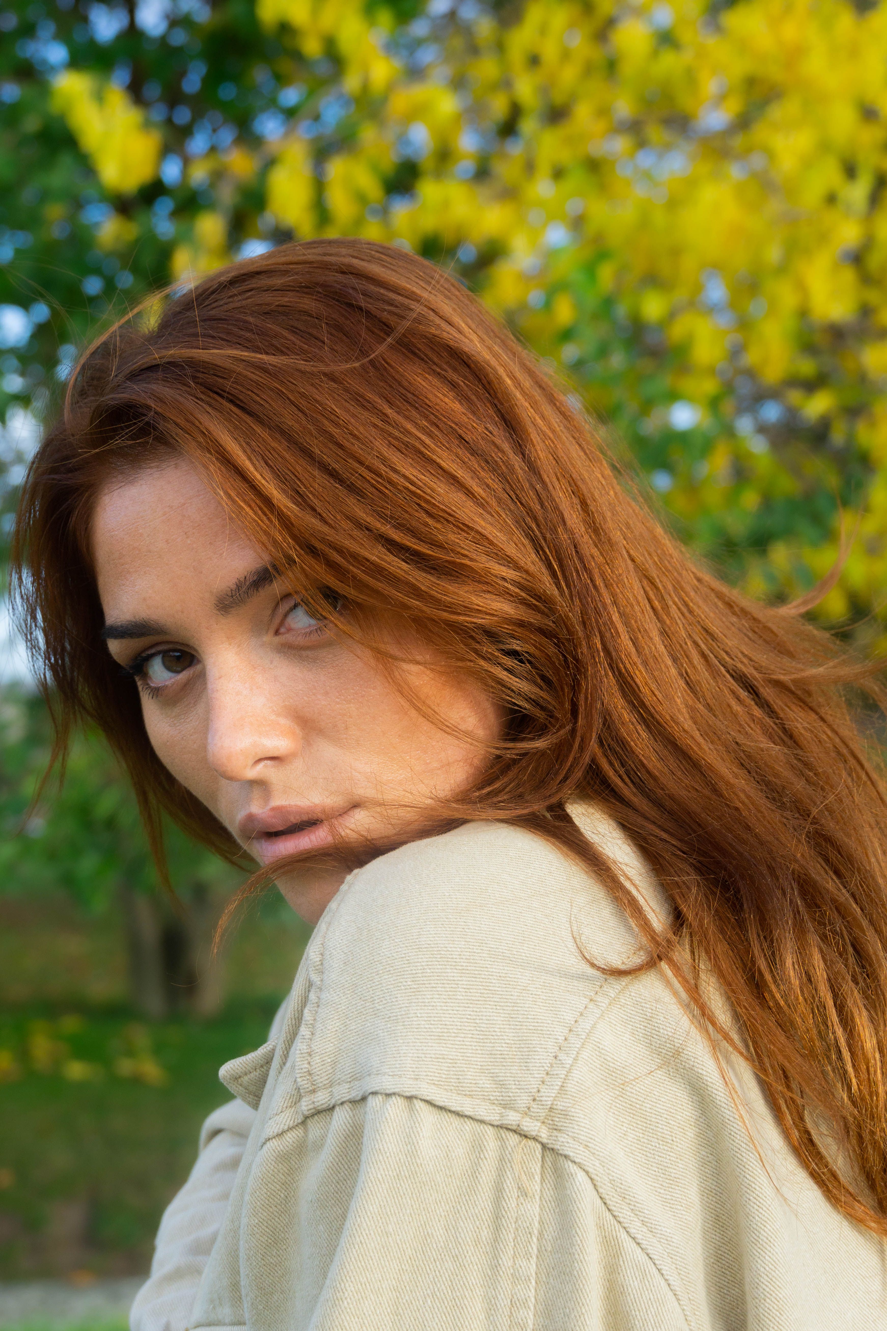 A woman with red hair posing for a portrait · Free Stock Photo