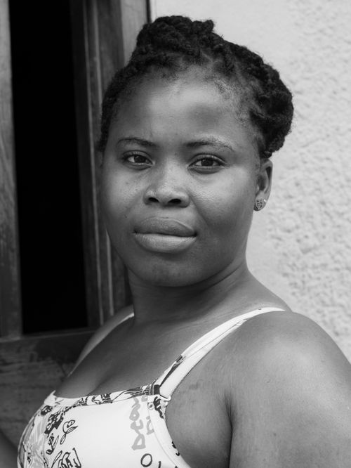 Free A compelling black and white portrait capturing a woman's thoughtful expression. Stock Photo