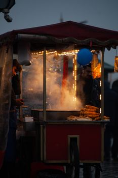 Steam rising from a street corn vendor at night, Istanbul, Turkey.