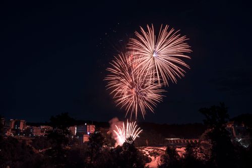 Free Dazzling fireworks illuminate the night sky over Neuhausen am Rheinfall, Switzerland. Stock Photo