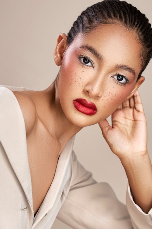 Studio Shot of a Beautiful Woman Wearing Red Lipstick 