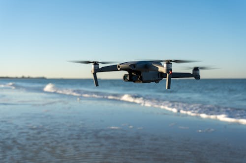Close-up of a Drone over a Sea and Beach 