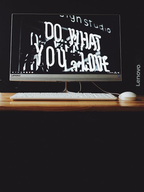 Free Gray Lenovo Flat Screen Monitor Displaying Do What You Love Neon Signage Stock Photo