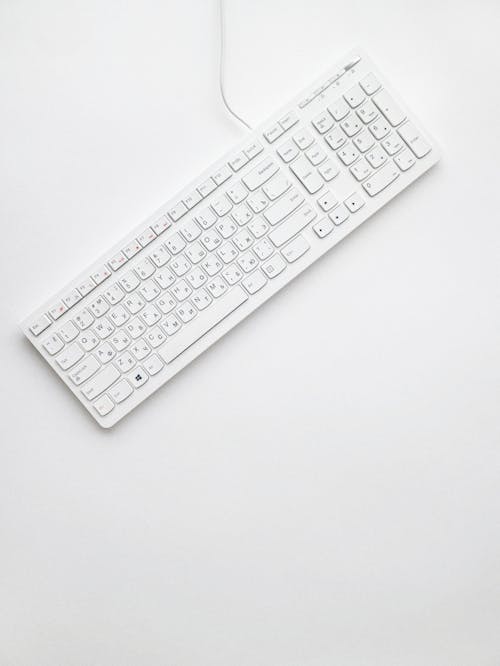 Free Top View Photo of White Keyboard Stock Photo