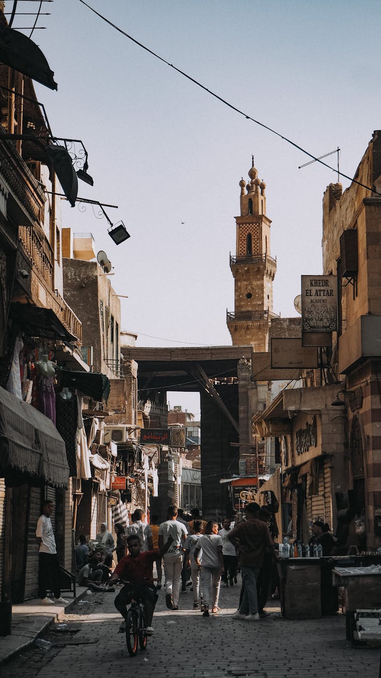 People Walking On Street In Old Town