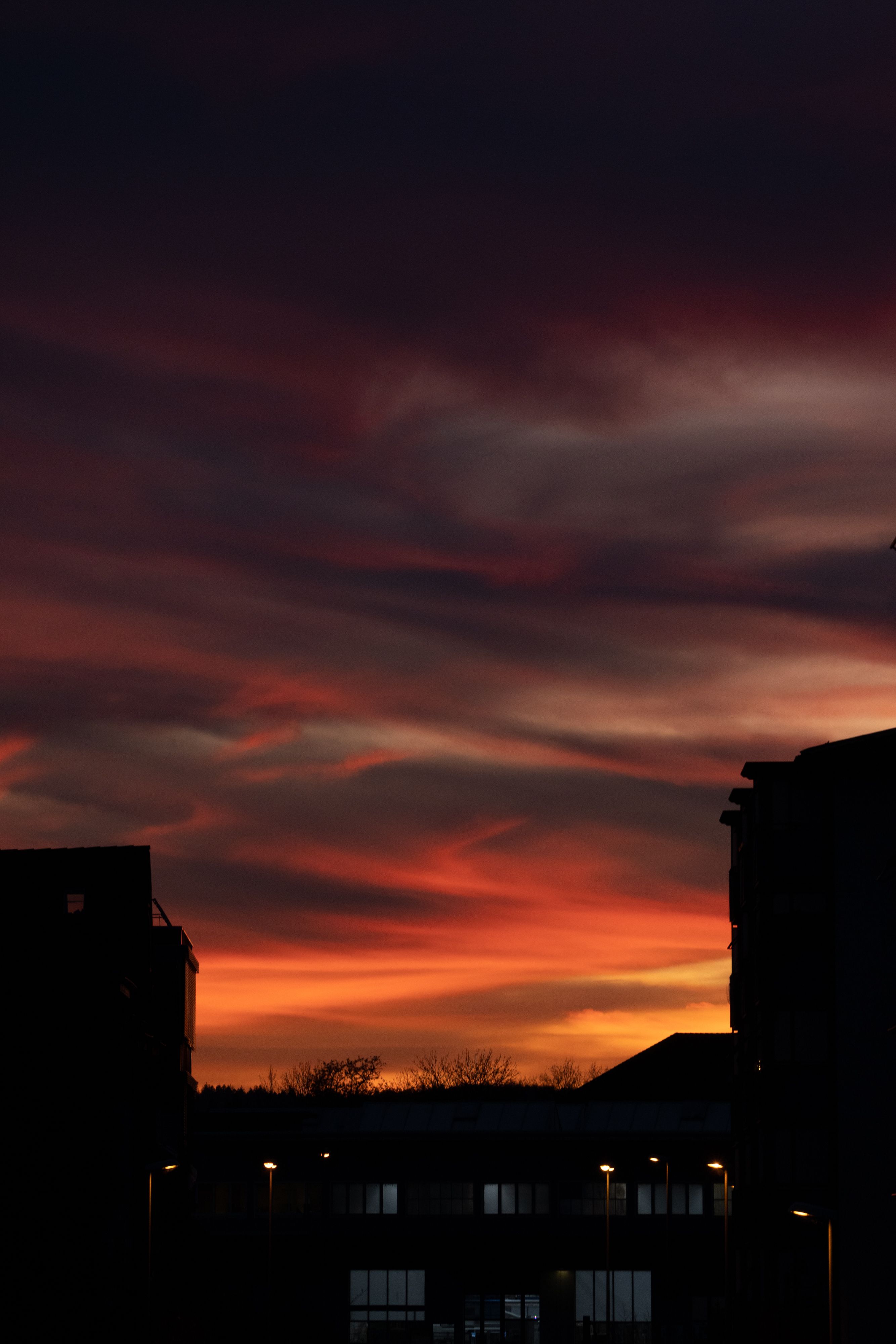 Silhouetted Buildings in City under a Dramatic Sunset Sky · Free Stock ...